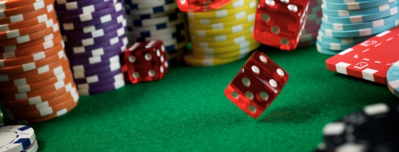 A casino table with dice and poker chips